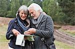 Senior couple looking at map