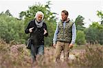 Father and adult son walking