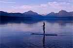 Woman on canoe, Lake McDonald, Glacier National Park, Montana, USA