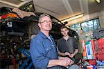 Two mechanics in garage