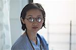 Portrait of young female doctor in office