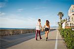 Young couple walking at San Diego beach