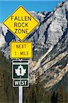 Close-up of sign on Trans Canada Highway with Rocky Mountains in background, near Revelstoke, BC, Canada