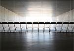 Silhouette of office chairs lined up in a row