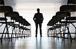 Silhouette of businessman standing in office