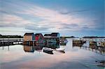 Rowboats and buildings on calm bay