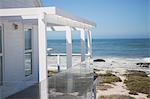 Beach house and balcony overlooking ocean