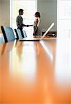 Business people shaking hands in conference room