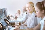 Businesswoman wearing headset in office