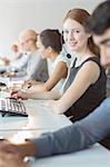 Businesswoman wearing headset in office