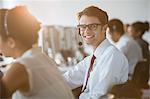 Businessman wearing headset in office