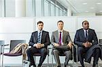 Businessmen sitting in waiting area