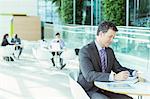 Businessman working in cafe