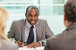 Businessman taking notes in meeting