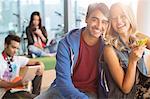 University students smiling in lounge