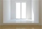 Bright light coming from a window illuminating a white room