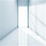 Bright light coming from a door illuminating a white corridor