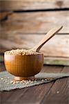 Soy wooden bowl on a wooden surface, eco product.