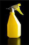 yellow spray bottle for wet cleaning on black background