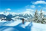 Winter mountain fir forest snowy landscape (top of Papageno bahn - Filzmoos, Austria) and woman.