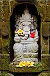 ganesh hindu god stone statue in bali indonesia