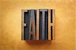 The word FAITH written in vintage letterpress type.