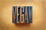 The word VEGAN written in vintage letterpress type.