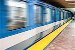 Abstract Moving subway train and Motion blur with an empty subway platform.