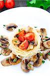 Pasta with fried mushrooms and cherry tomato