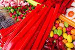 Assorted  colorful liqourice candy on display at a market stall