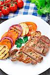 Delicious steak with grilled vegetables on a plate