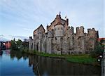 Gravensteen castle over canal waters, Ghent, Belgium