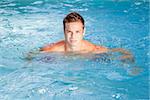 An image of a beautiful man swimming in the pool