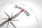An image of a nice blue compass with the word success