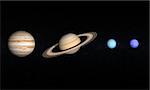 A comparison between the Gas Planets Jupiter, Saturn, Uranus and Neptune on a starry background.