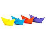 Four colored paper ship on a white background