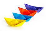 Four colored paper ship on a white background