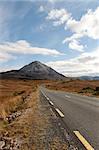 road to the Errigal mountains in county Donegal Ireland on a bright cloudy day