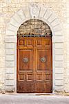 An image of an old door in Siena Italy