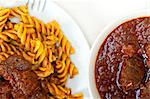 fusilli pasta al dente with neapolitan style ragu meat sauce very different from bolognese style