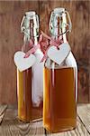 Bottles with freshly made elderberry syrup, alternative medicine for cough, cold or flu.