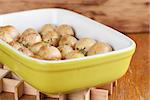 Roasted baby potatoes with thyme, olive oil and salt on baking sheet