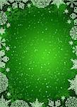 Christmas frame. White snowflakes on the green background