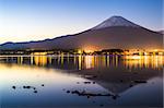 Mt. Fuji at dusk over Lake Kawaguchi in Japan.