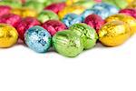 Chocolate Easter eggs border isolated on white background