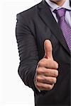 Close-up mid section of a young businessman gesturing thumbs up over white background