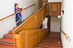 Student reading her notes on the stairs at the university