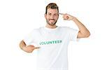 Portrait of a happy male volunteer pointing to himself over white background