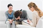 Young couple in meeting with a financial adviser at home