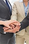 Extreme closeup of a business team joining hands together